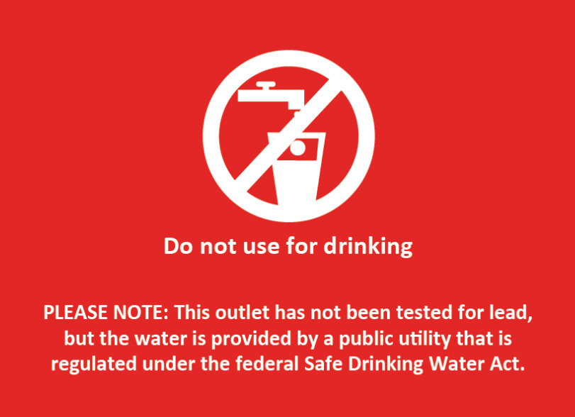 A red sign that reads: Do not use for drinking PLEASE NOTE: This outlet has not been tested for lead, but the water is provided by a public utility that is regulated under the federal Safe Drinking Water Act.